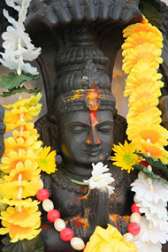 A garlanded statue of Patanjali